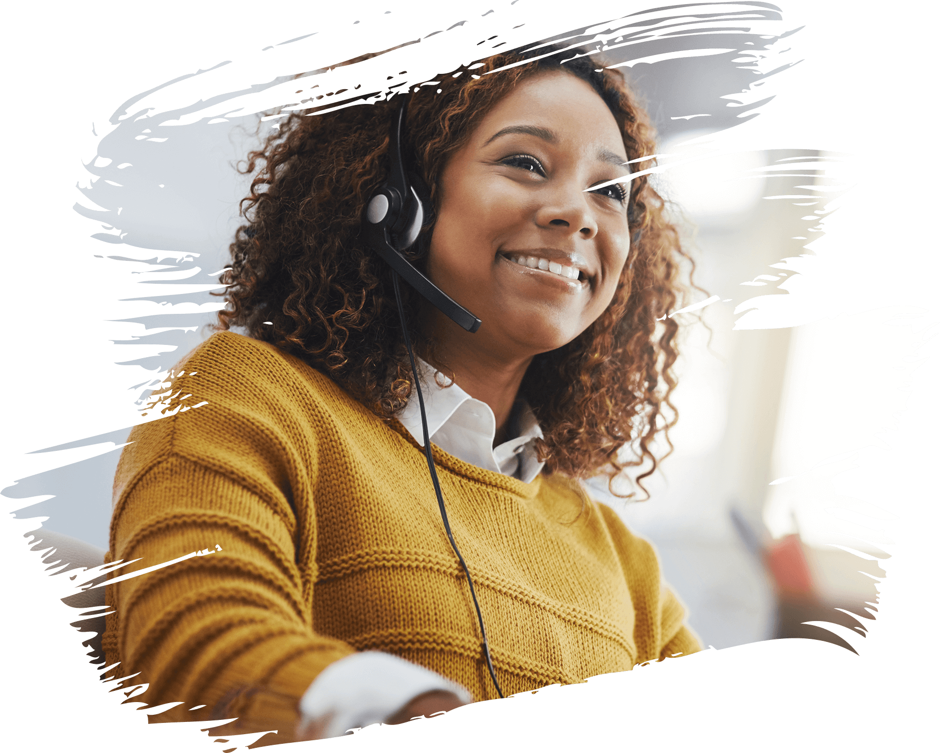 Smiling customer service representative with headset in office