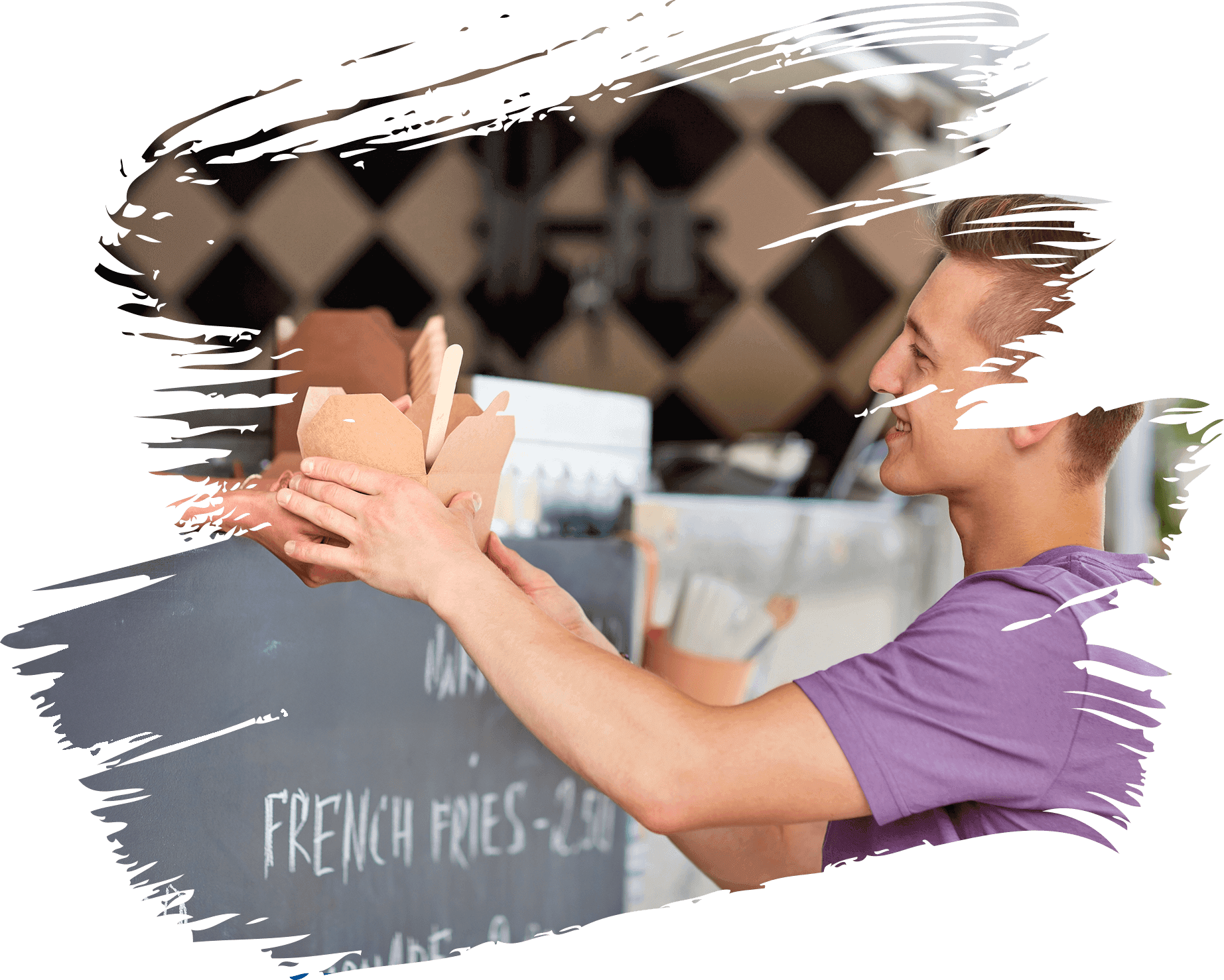 Smiling vendor handing food in takeaway boxes at a counter