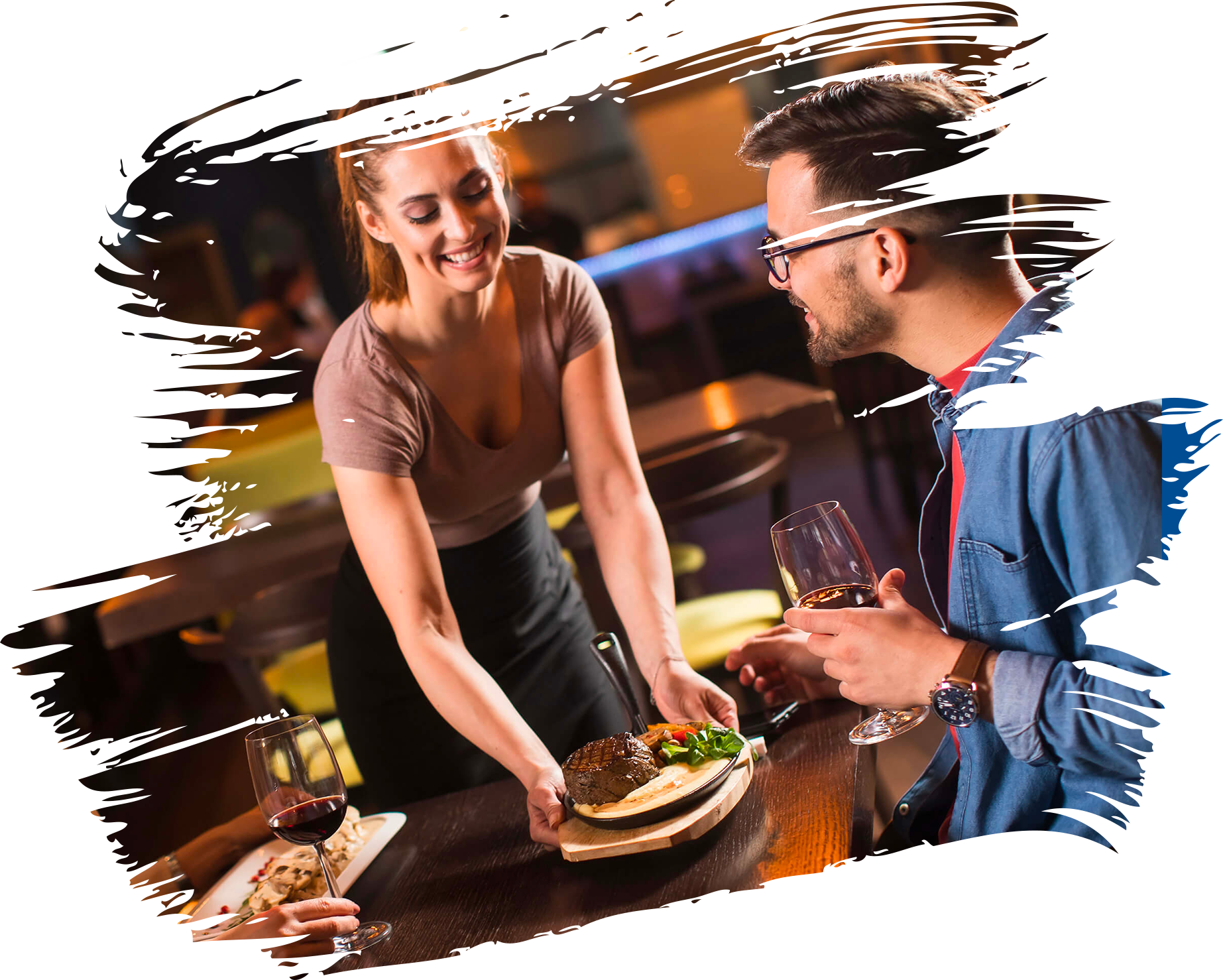 Waitress serving steak to customers in a restaurant setting
