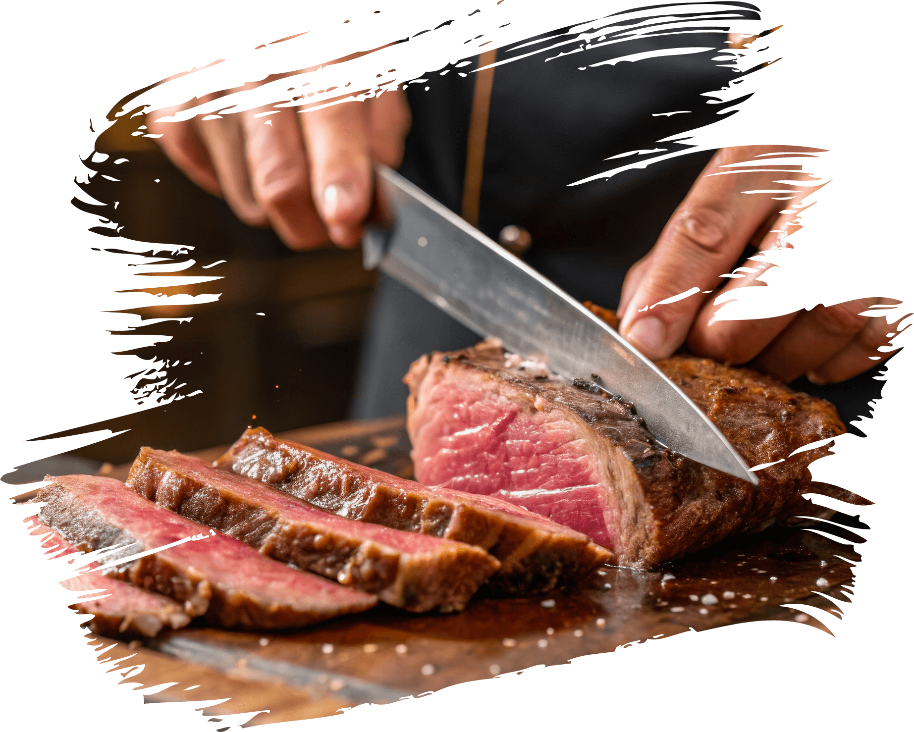 Chef slicing medium-rare steak on wooden board